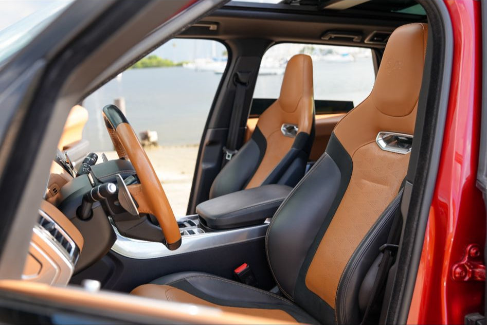 Alt text: "Luxury leather car seats showcasing sophisticated design and premium craftsmanship in a modern SUV interior, perfect for enhancing driving comfort and style."