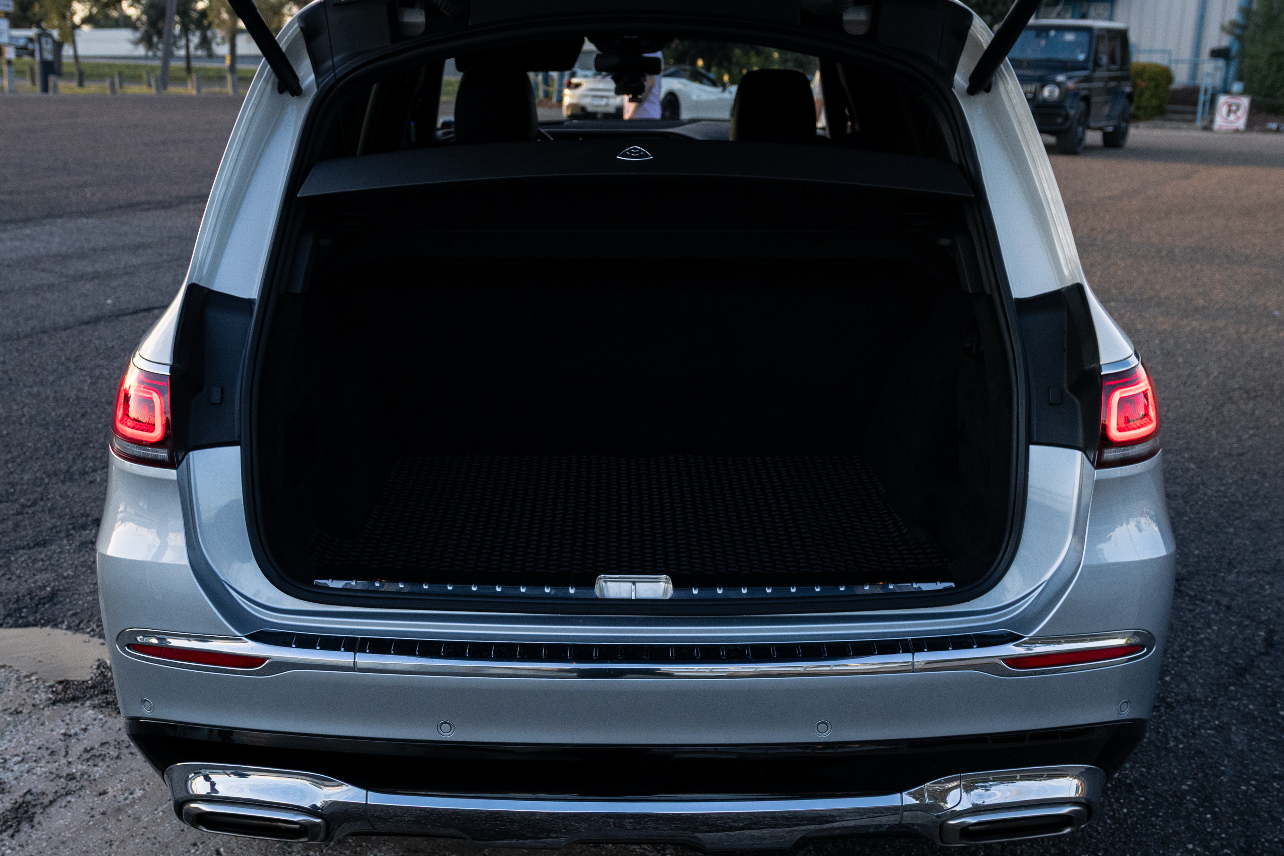 "Spacious cargo area of a modern SUV, showcasing a sleek design and ample storage space for all your travel needs. Ideal for outdoor adventures and road trips."