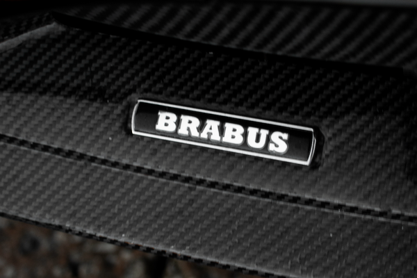 Brabus logo on a carbon fiber surface