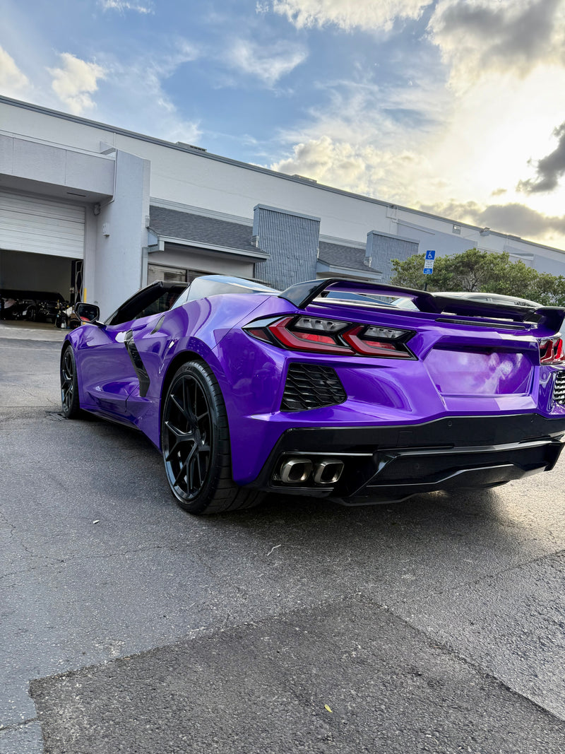 2021 Corvette C8 Midnight purple on Red convertible - three quarter rear - purple corvette c8