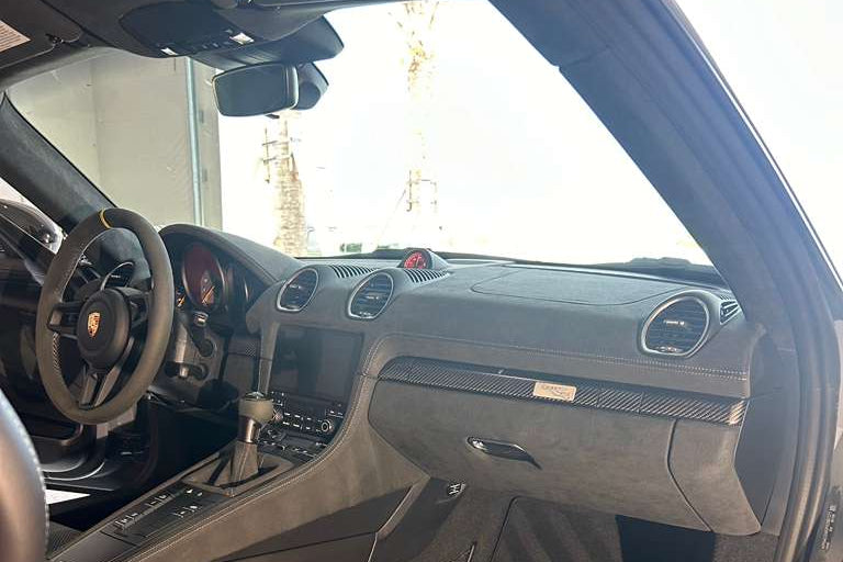 Car interior with visible branding on the door sill