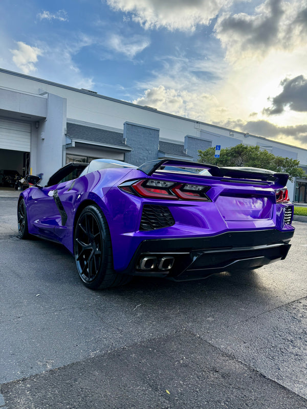 2021 Corvette C8 Midnight purple on Red convertible - three quarter rear - purple corvette c8