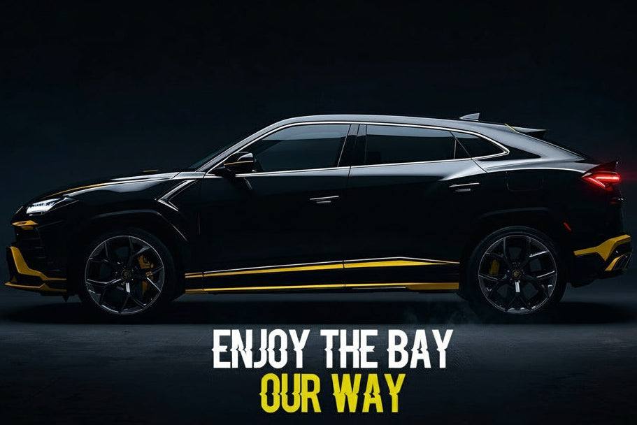 Black SUV with 'Enjoy the Bay Our Way' text on a dark background